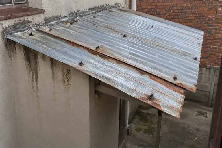 Illustration of weathering at corrugated metal-roof laps and fixings